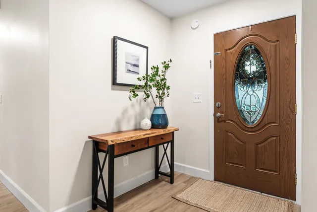 a view of a hallway with paintings on the wall