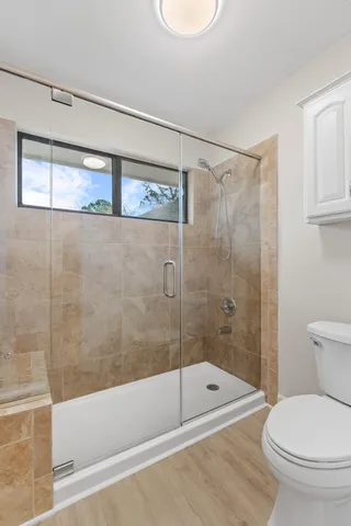 a bathroom with a toilet a sink and bathtub
