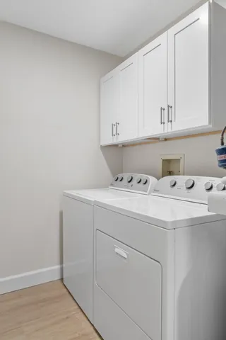 a view of a backyard with plants and patio