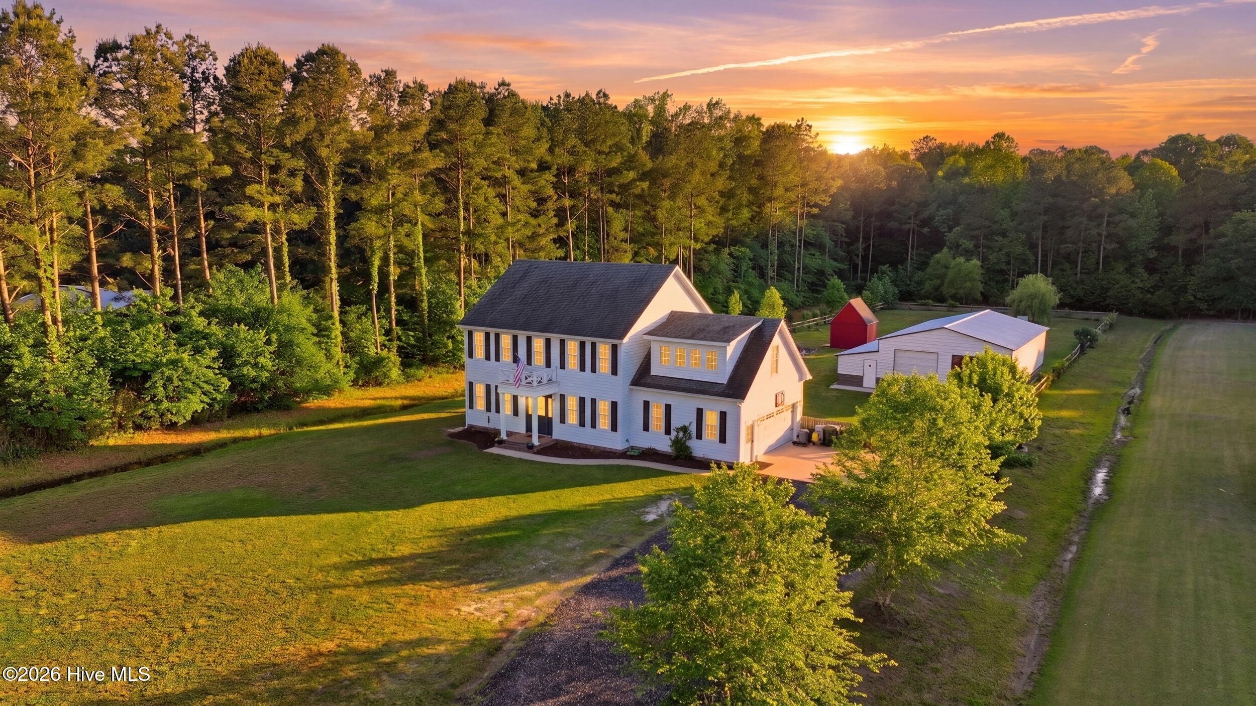 157 Pudding Ridge Road South Mills, NC 27976 - Photo 1 of 44 1_003_dji_20260510185400_0342_d_twilight