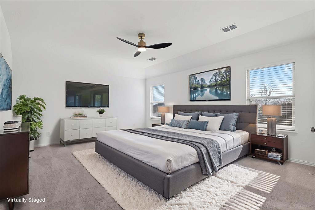 2325 Myrtle Way Melissa, TX 75454 - Photo 14 of 22 a bedroom with a large bed and a flat screen tv