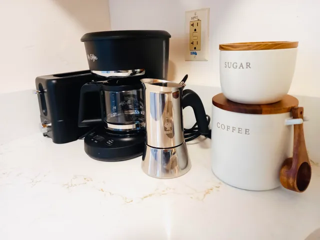 a kitchen with a stove and a refrigerator