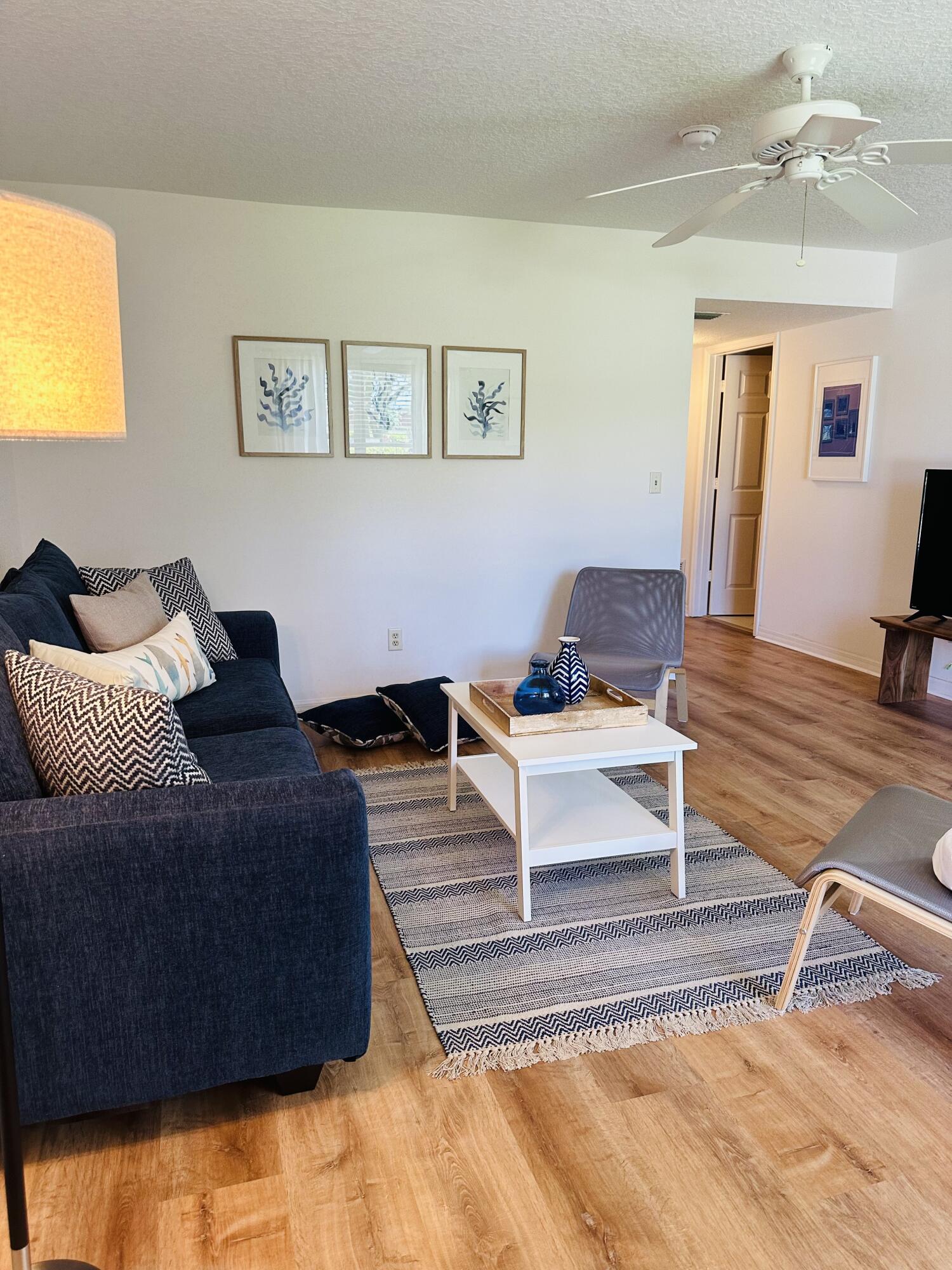 80 Crooked Tree Lane, Unit 106 Vero Beach, FL 32962 - Photo 2 of 47 a living room with furniture and a couch