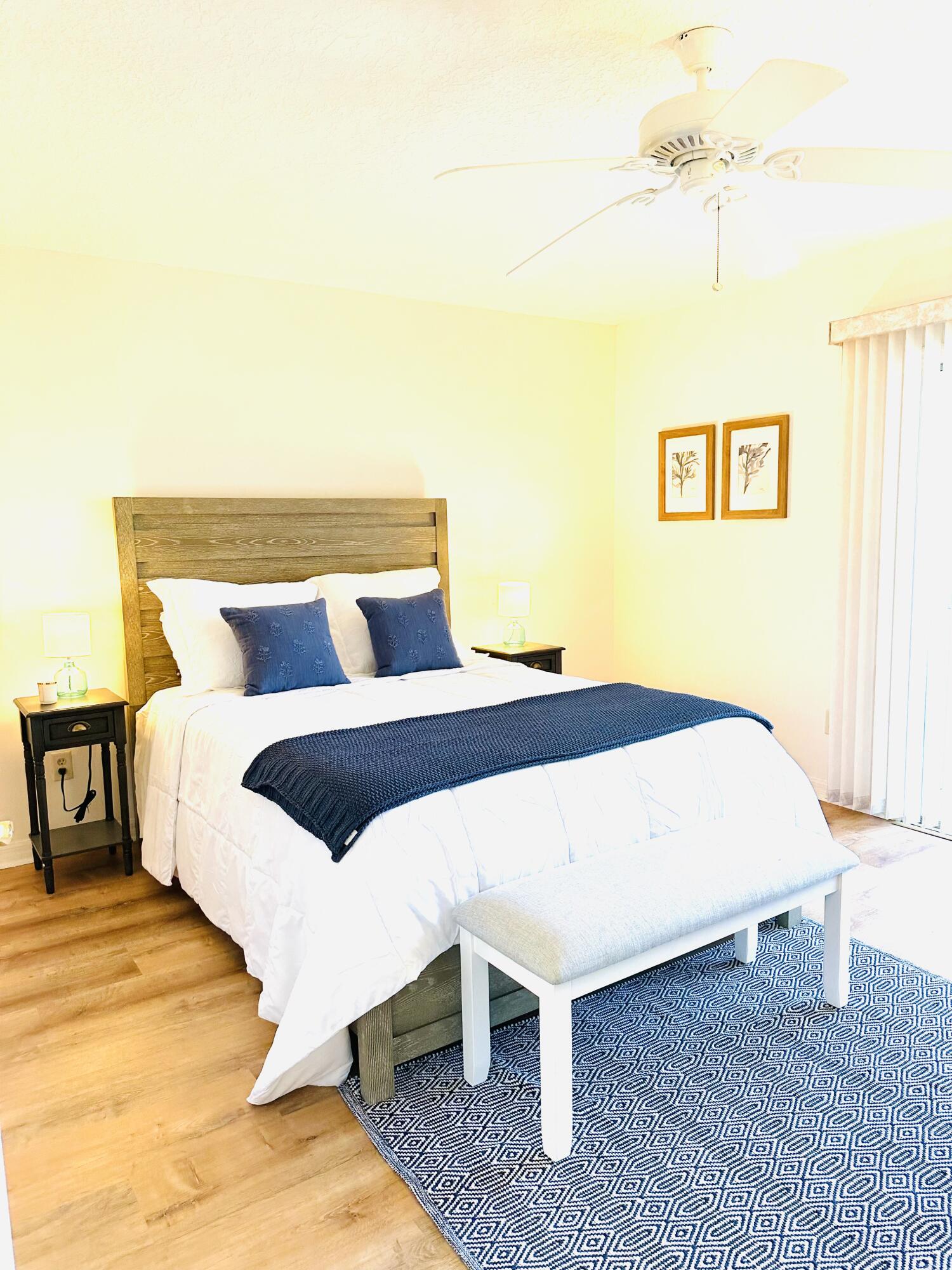 80 Crooked Tree Lane, Unit 106 Vero Beach, FL 32962 - Photo 27 of 47 a bedroom with a bed and a night stand