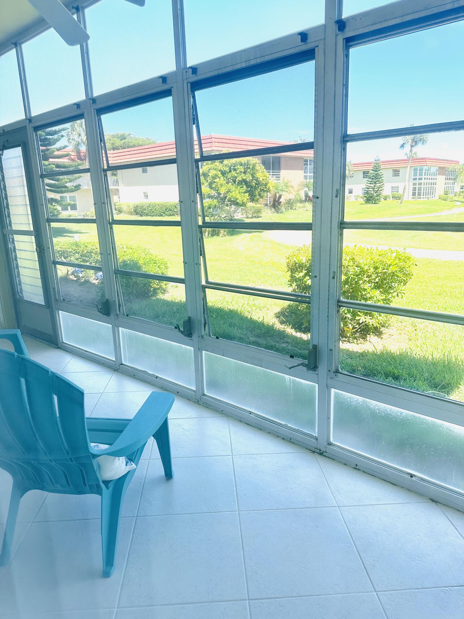 80 Crooked Tree Lane, Unit 106 Vero Beach, FL 32962 - Photo 46 of 47 a view of a room with a floor to ceiling window in an empty room