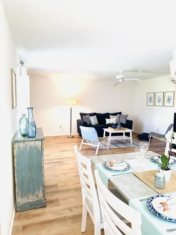 a living room with furniture and flat screen tv