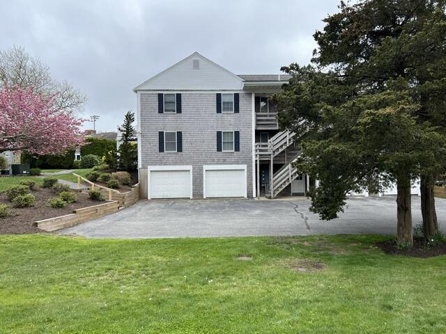 99 Depot Road, Unit 23 Chatham, MA 02633 - Photo 4 of 4 a view of outdoor space yard and front view of a house