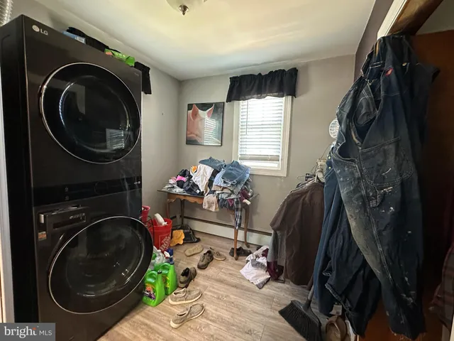 a view of a storage and utility room with washer and dryer