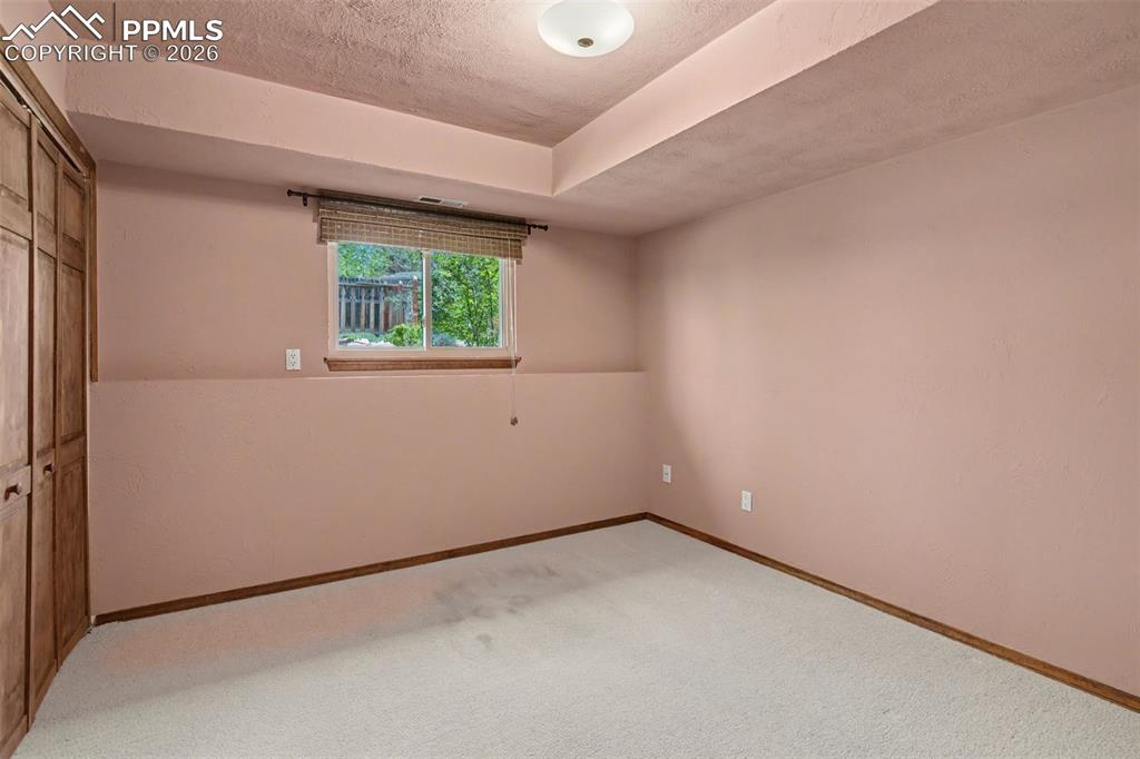 5301 Pinon Valley Road Colorado Springs, CO 80919 - Photo 20 of 27 an empty room with windows
