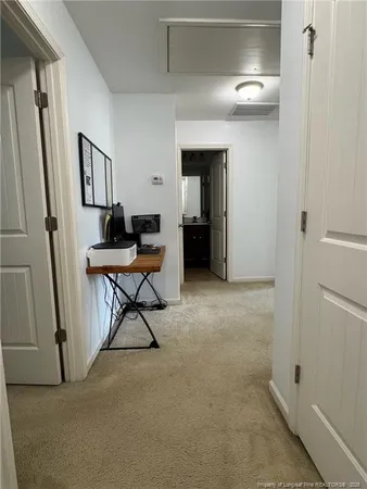 a spacious bedroom with a bed and a couch