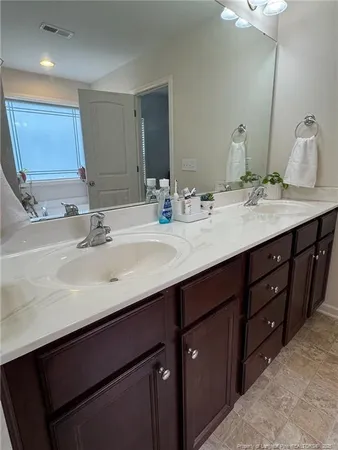 a view of a bathroom with a glass door shower