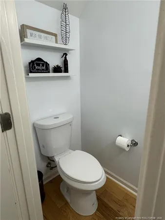a bathroom with a toilet and a sink