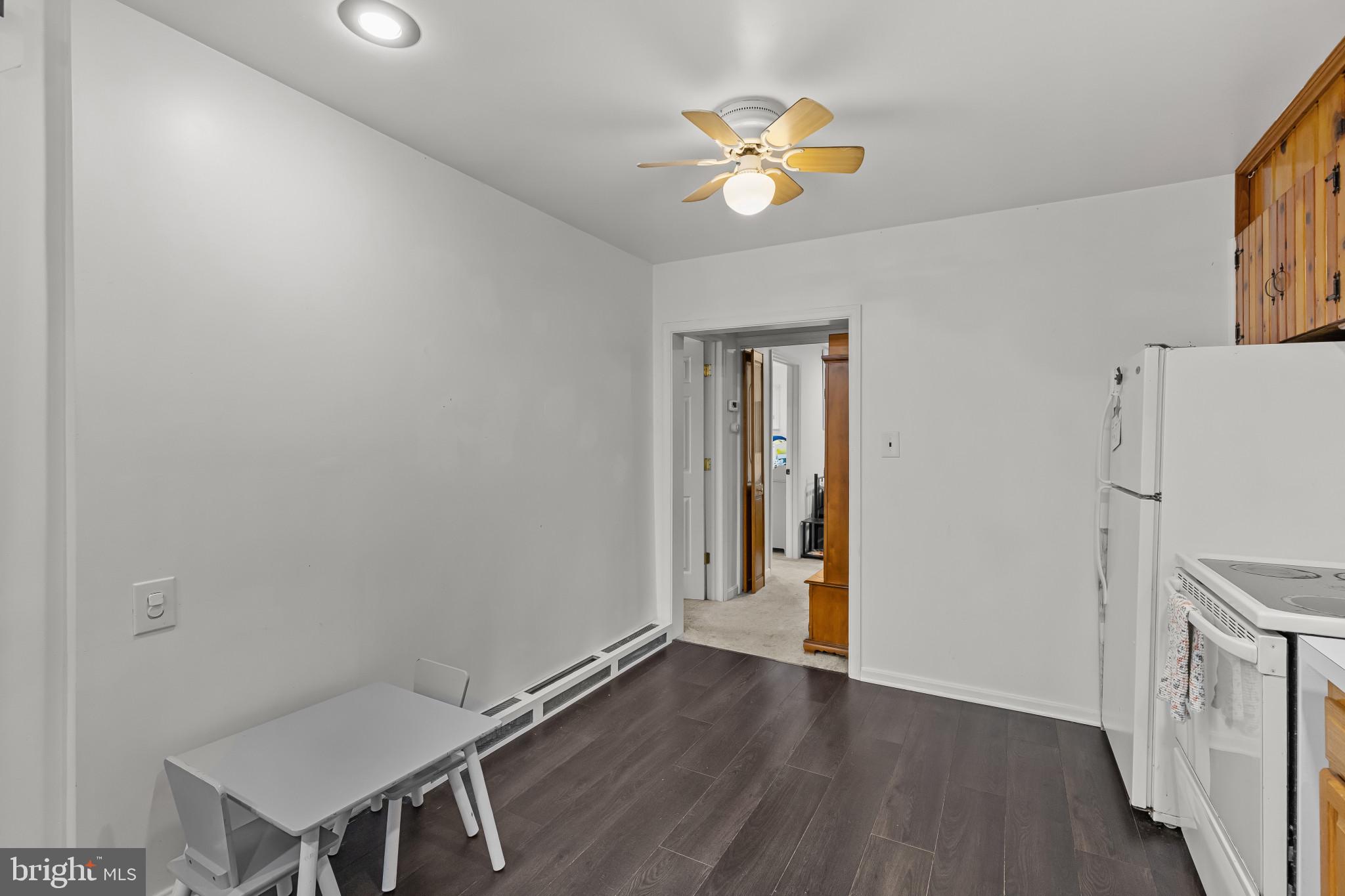 6913 River Drive Road Baltimore, MD 21219 - Photo 13 of 32 a view of a room with wooden floor and workspace