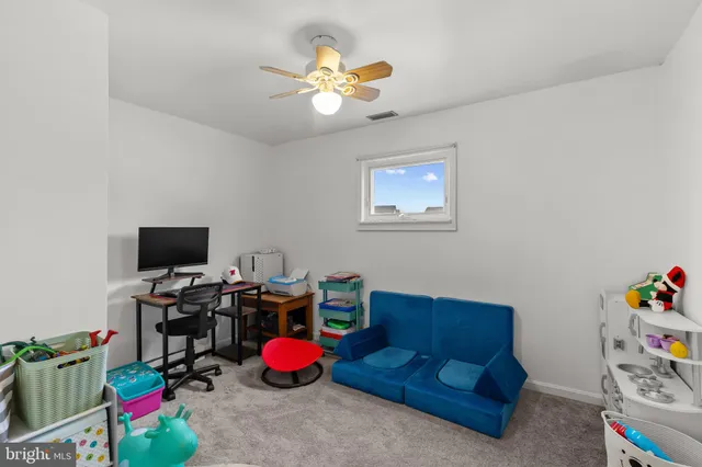 a view of a workspace with furniture