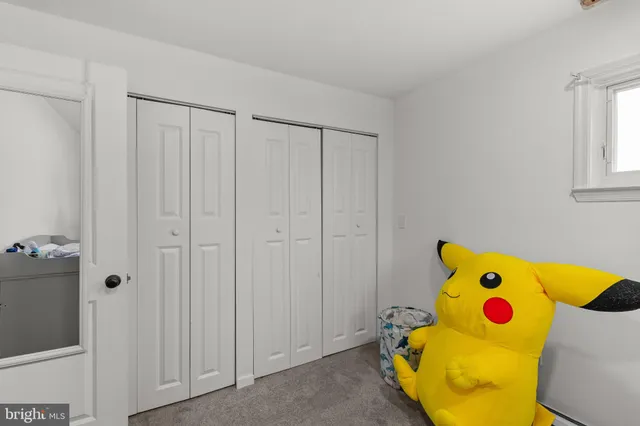 a bathroom with a tub and mirror