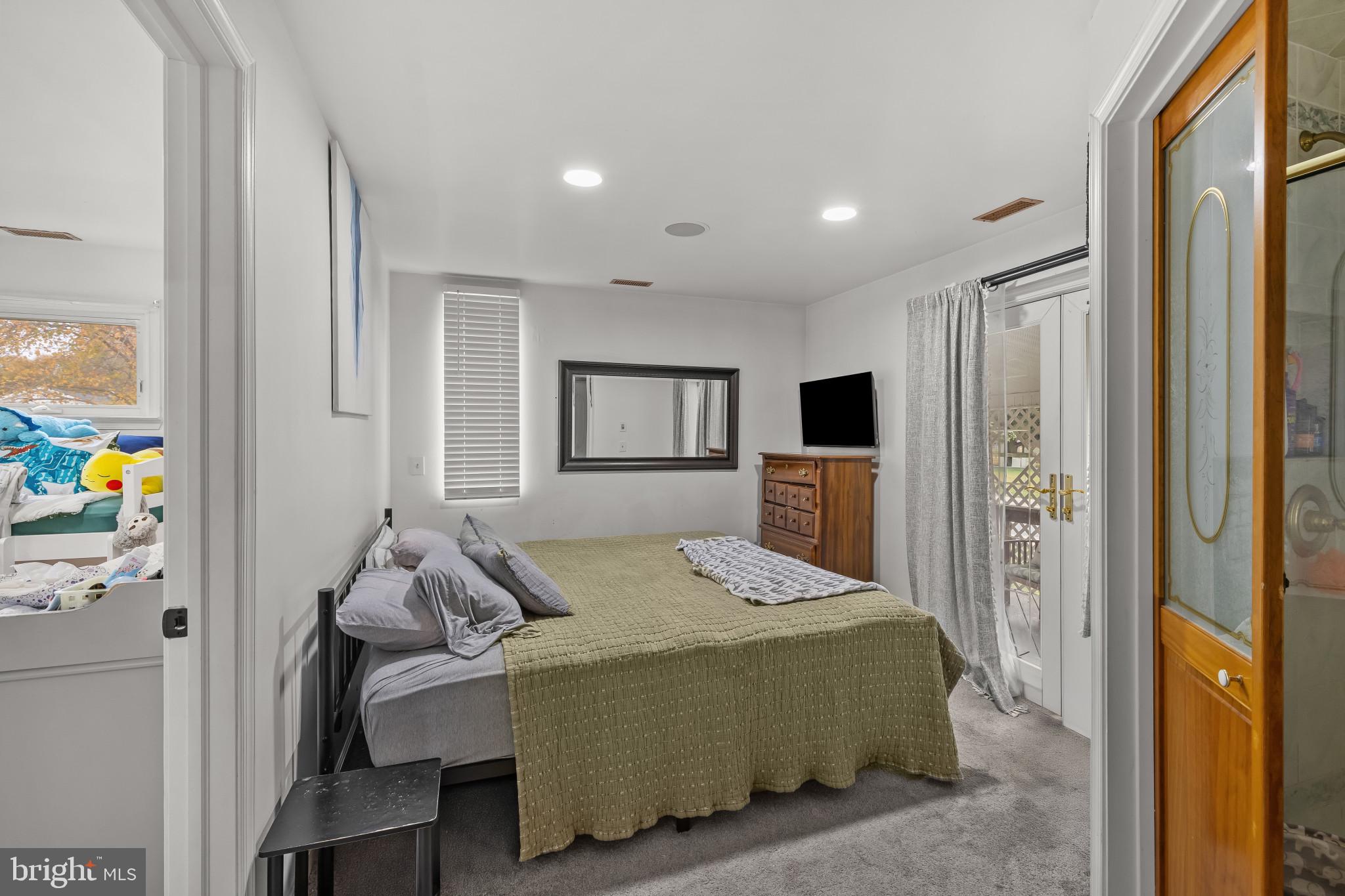 6913 River Drive Road Baltimore, MD 21219 - Photo 20 of 32 a bedroom with a bed and furniture