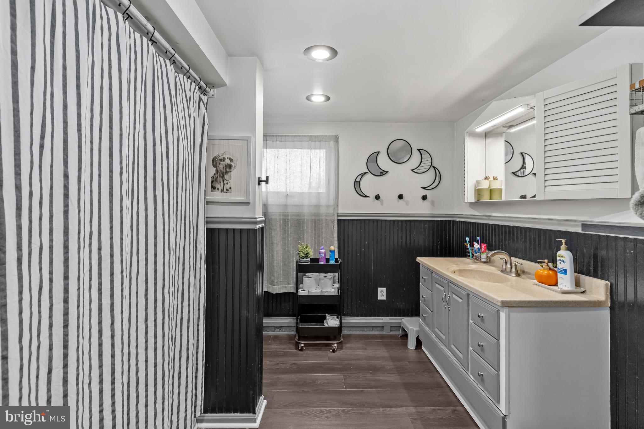 6913 River Drive Road Baltimore, MD 21219 - Photo 25 of 32 a storage room with washer and dryer