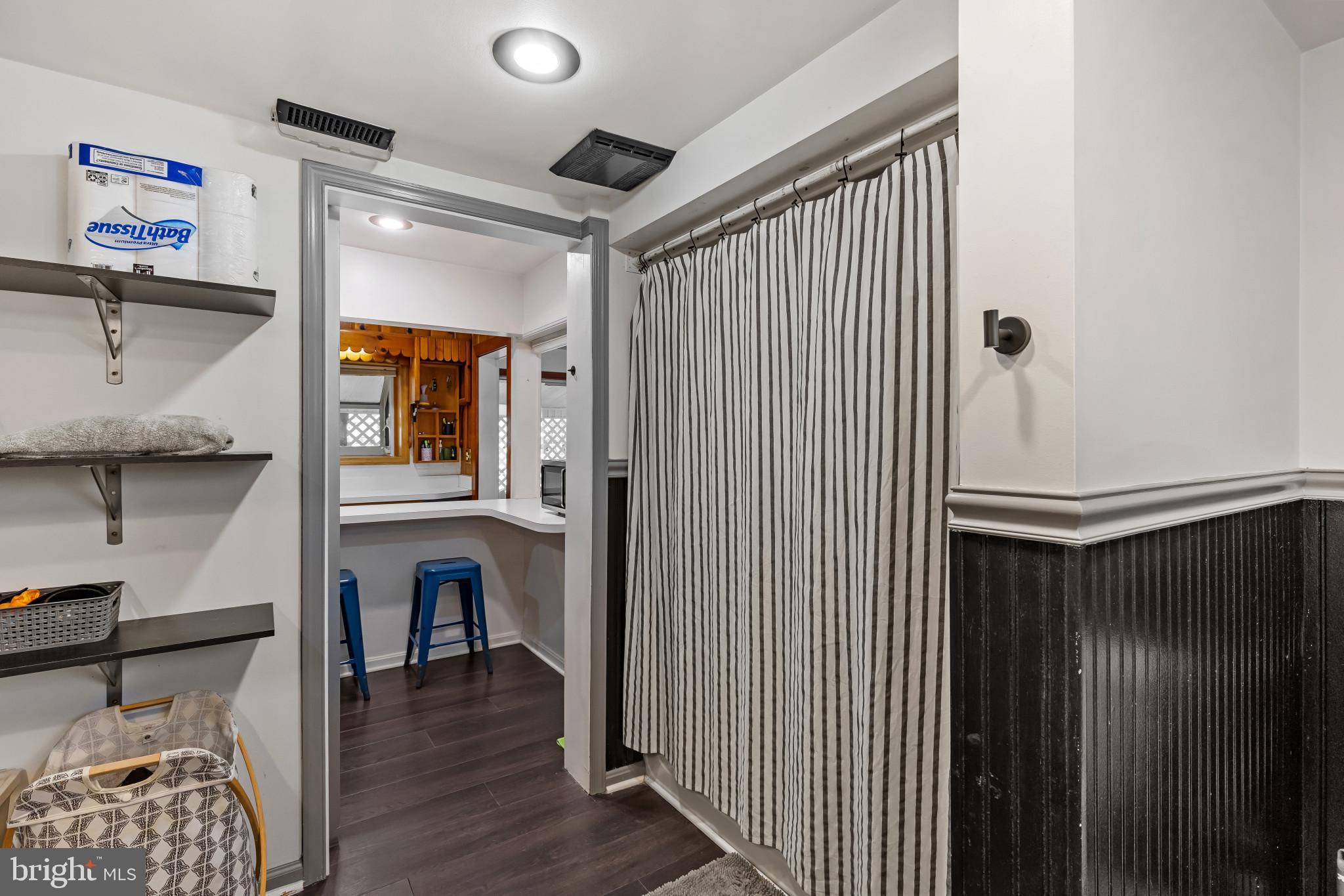 6913 River Drive Road Baltimore, MD 21219 - Photo 27 of 32 a view of livingroom with furniture and wooden floor