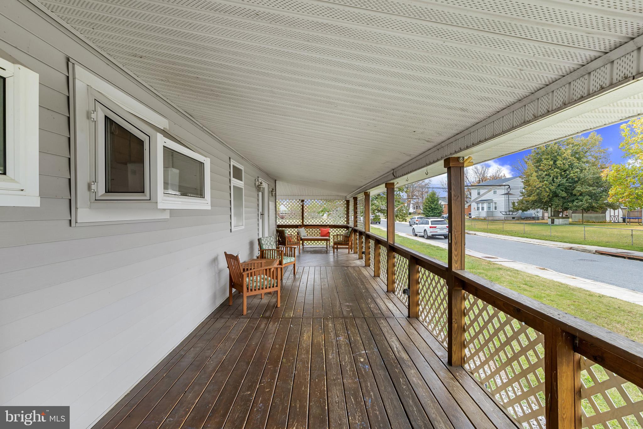 6913 River Drive Road Baltimore, MD 21219 - Photo 29 of 32 a view of a patio with wooden floor and outdoor space