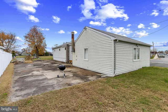 a view of a backyard with a tree