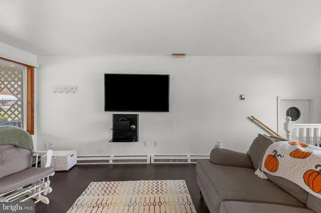 a living room with a couch and a flat screen tv