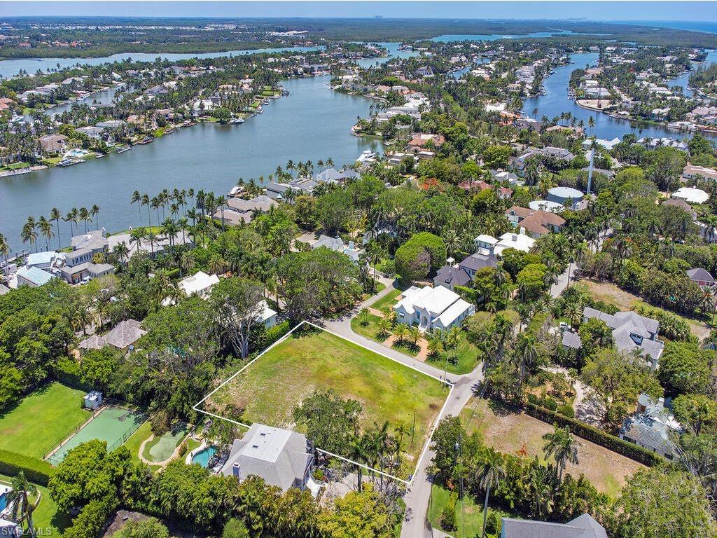 2545 Lantern Lane Naples, FL 34102 - Photo 3 of 5 an aerial view of lake residential houses with outdoor space and swimming pool
