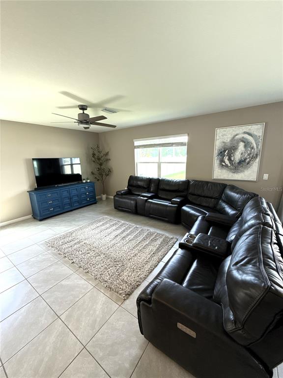 8446 Hardy Bay Loop Wesley Chapel, FL 33545 - Photo 13 of 38 a living room with furniture