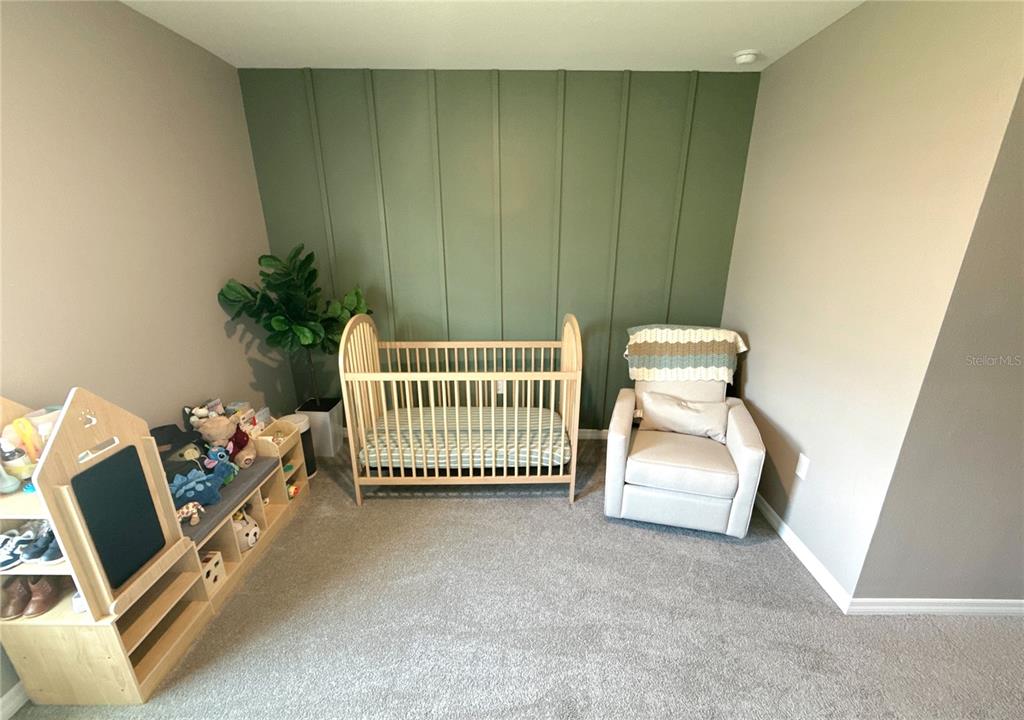 8446 Hardy Bay Loop Wesley Chapel, FL 33545 - Photo 16 of 38 a room with a couch and a couch