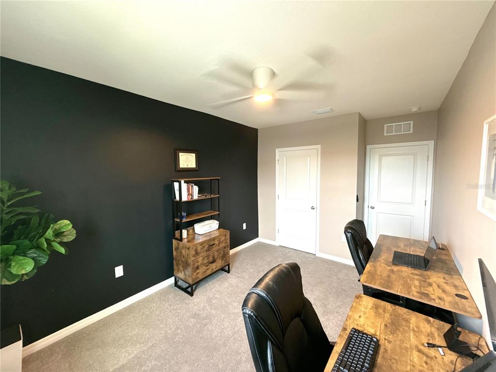 8446 Hardy Bay Loop Wesley Chapel, FL 33545 - Photo 18 of 38 a living room with furniture