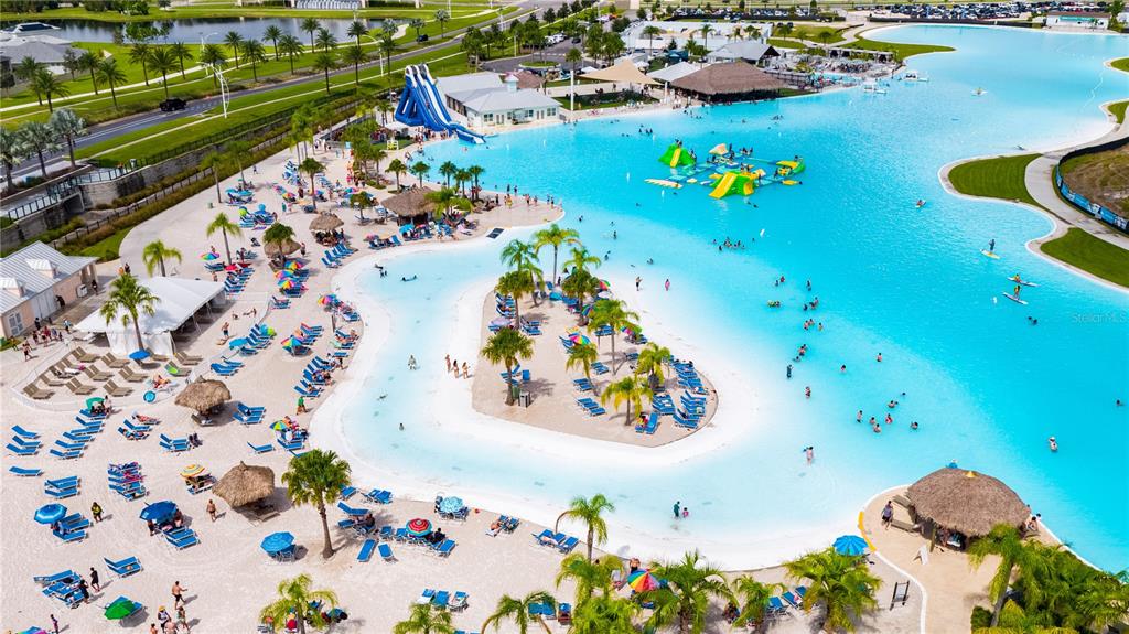 8446 Hardy Bay Loop Wesley Chapel, FL 33545 - Photo 2 of 38 an aerial view of a house swimming pool and lounge chairs