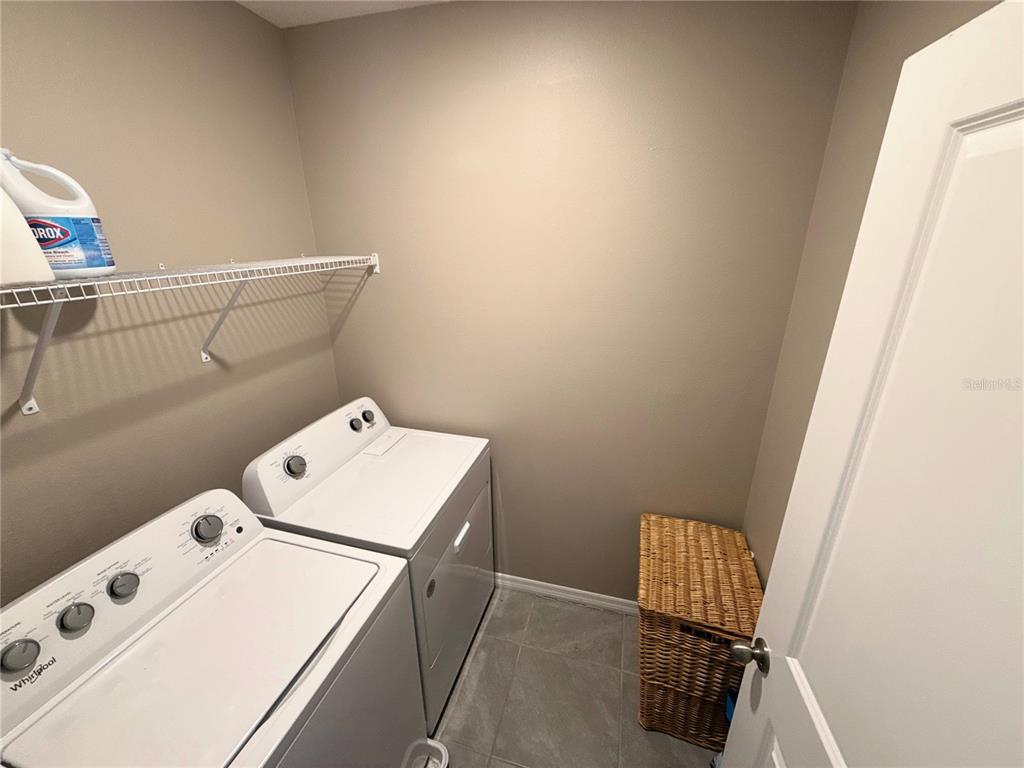 8446 Hardy Bay Loop Wesley Chapel, FL 33545 - Photo 22 of 38 a utility room with dryer and washer