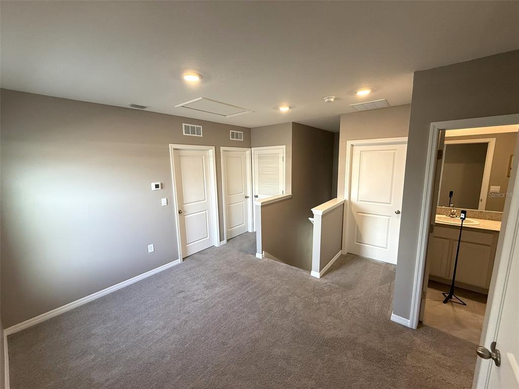 8446 Hardy Bay Loop Wesley Chapel, FL 33545 - Photo 23 of 38 a view of an empty room