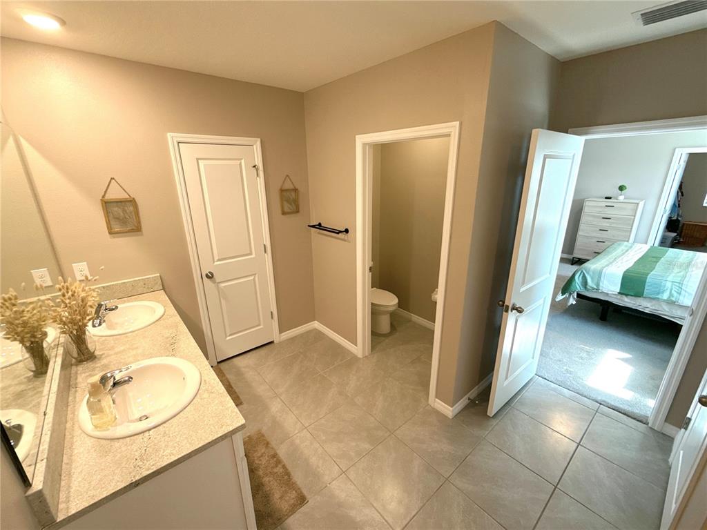 8446 Hardy Bay Loop Wesley Chapel, FL 33545 - Photo 27 of 38 a view of a storage & utility room