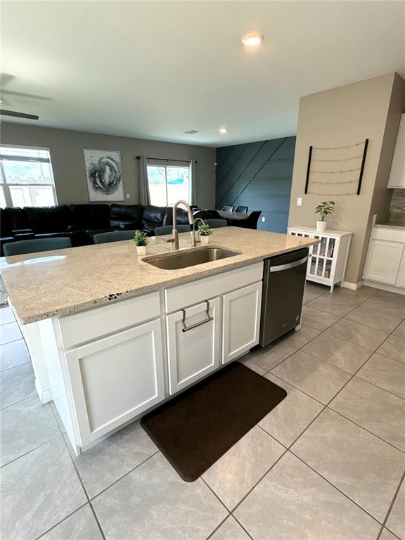 8446 Hardy Bay Loop Wesley Chapel, FL 33545 - Photo 6 of 38 a kitchen with a sink and a stove top oven