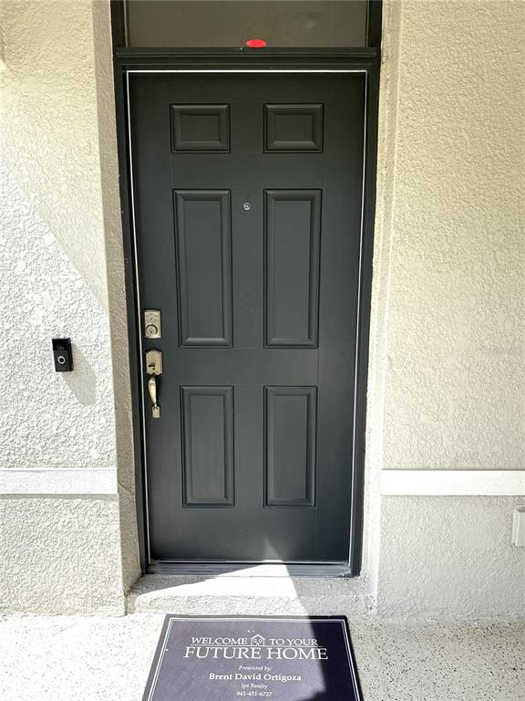 8446 Hardy Bay Loop Wesley Chapel, FL 33545 - Photo 7 of 38 a view of a door of the house