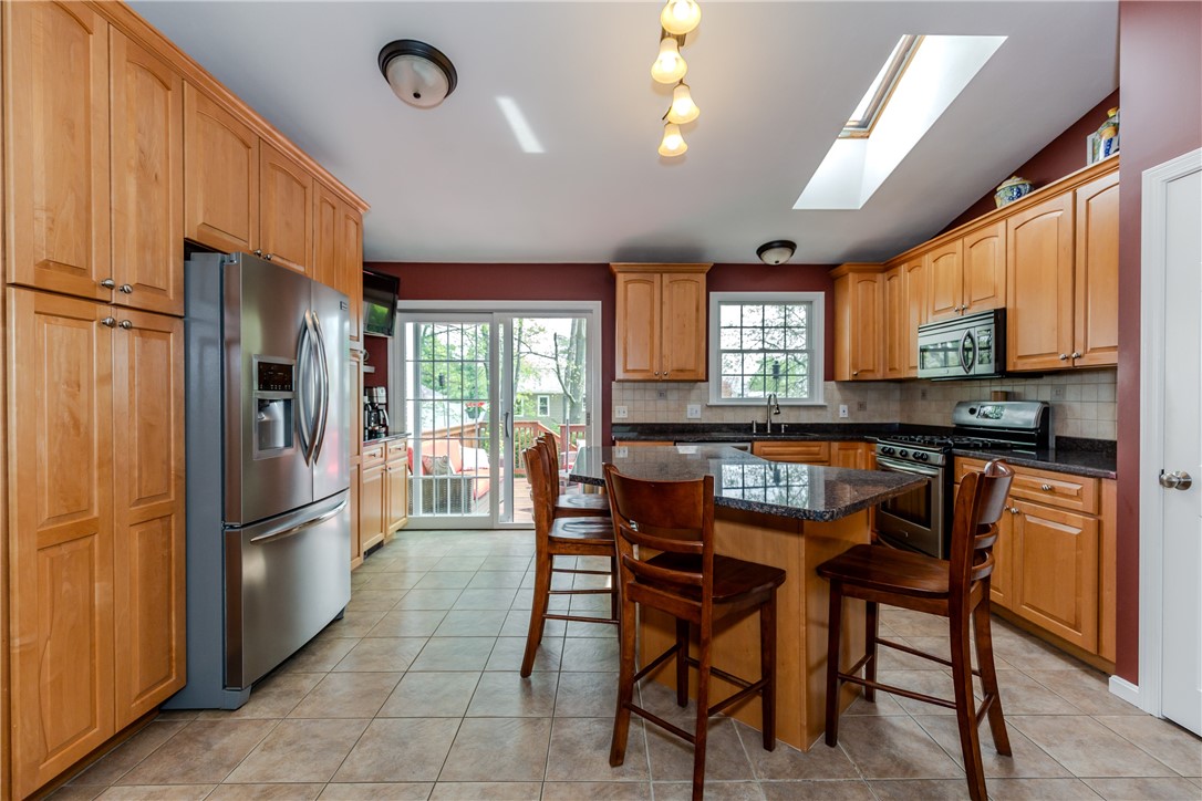 50 Thunder Trail Cranston, RI 02921 - Photo 11 of 49 Kitchen with sliding glass doors to deck