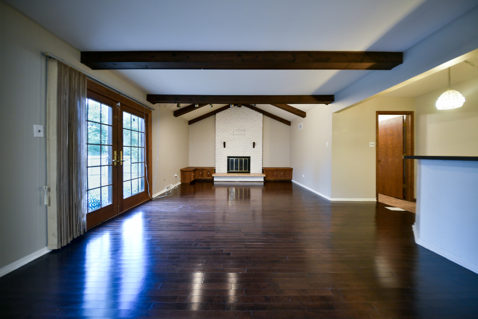 755 Cumnock Road Olympia Fields, IL 60461 - Photo 13 of 34 a big room with wooden floor chandelier and windows