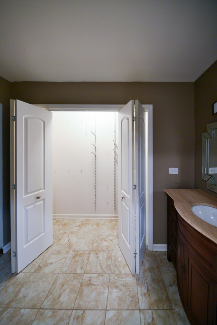 755 Cumnock Road Olympia Fields, IL 60461 - Photo 22 of 34 a bathroom with a granite countertop sink and a mirror