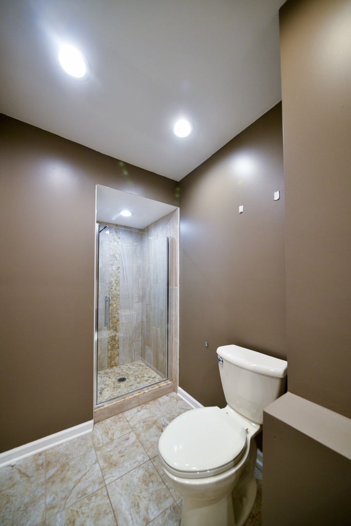 755 Cumnock Road Olympia Fields, IL 60461 - Photo 24 of 34 a bathroom with a toilet and a shower