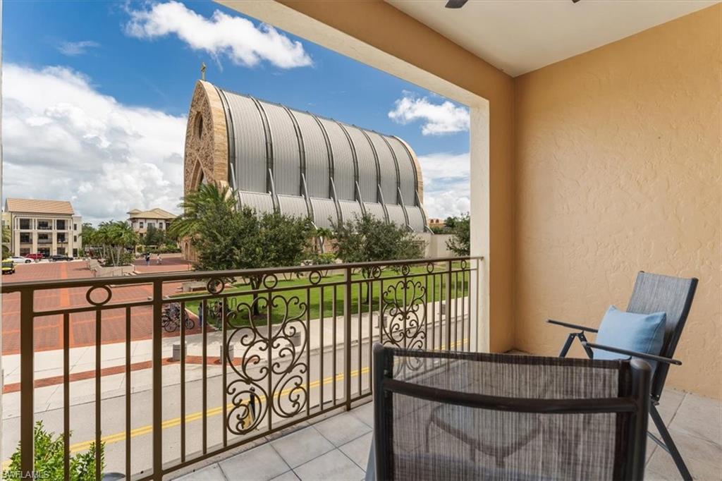 5080 Annunciation Circle, Unit 204 Ave Maria, FL 34142 - Photo 18 of 24 a view of a balcony with furniture