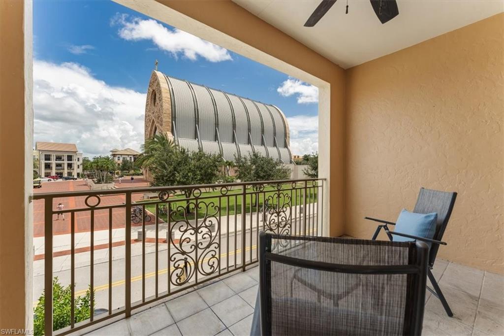 5080 Annunciation Circle, Unit 204 Ave Maria, FL 34142 - Photo 23 of 24 a view of a balcony with furniture