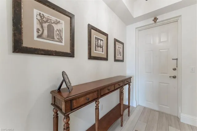 a view of an entryway with wooden floor