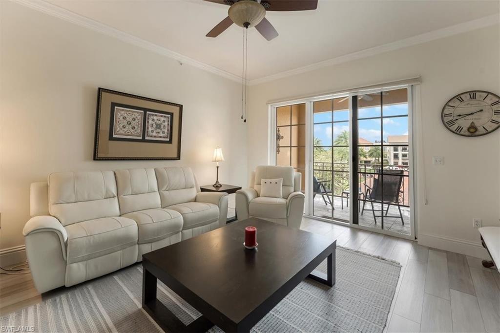 5080 Annunciation Circle, Unit 204 Ave Maria, FL 34142 - Photo 5 of 24 a living room with furniture and a window