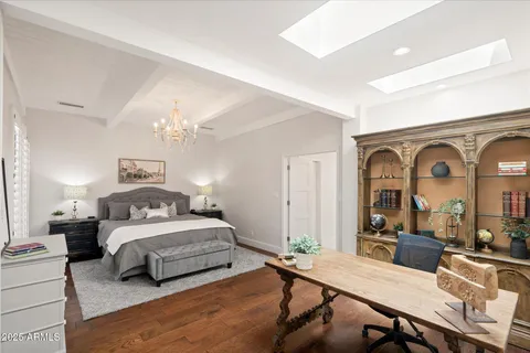 a bedroom with a bed window and furniture