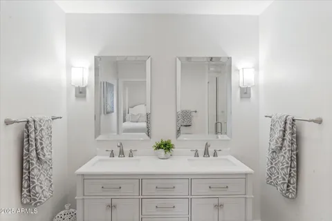 a bathroom with a shower sink and mirror