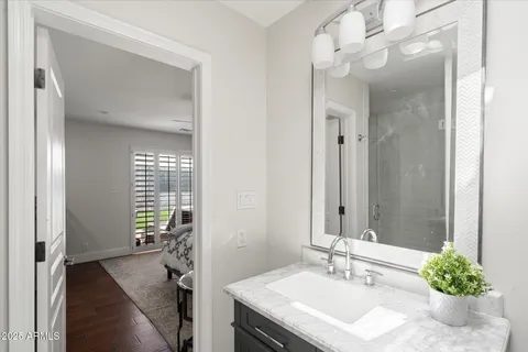 a bathroom with a sink double vanity and a mirror