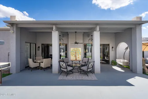 a living room with furniture and a potted plant
