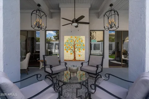 a view of a livingroom with furniture and a window