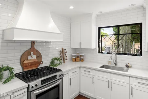 a kitchen with a stove and a sink
