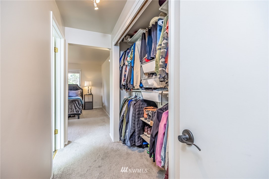 16204 Southeast 132nd Street Renton, WA 98059 - Photo 12 of 38 a view of walk in closet with clothes and shoes